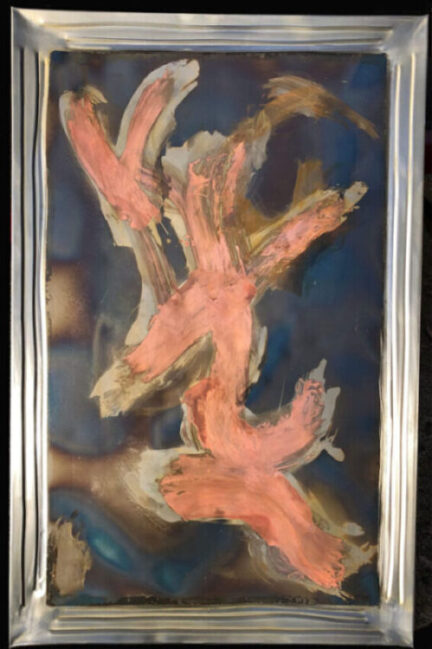 A painting with no paint made by forming the edge into a frame and then throwing fire and acids and chemicals into the center to create framed art.