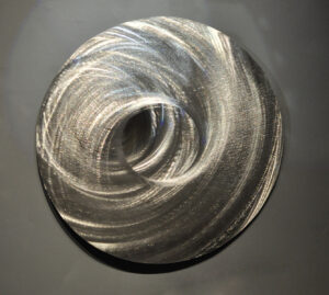 Apparently translucent layers of stainless steel swirling on top of each other